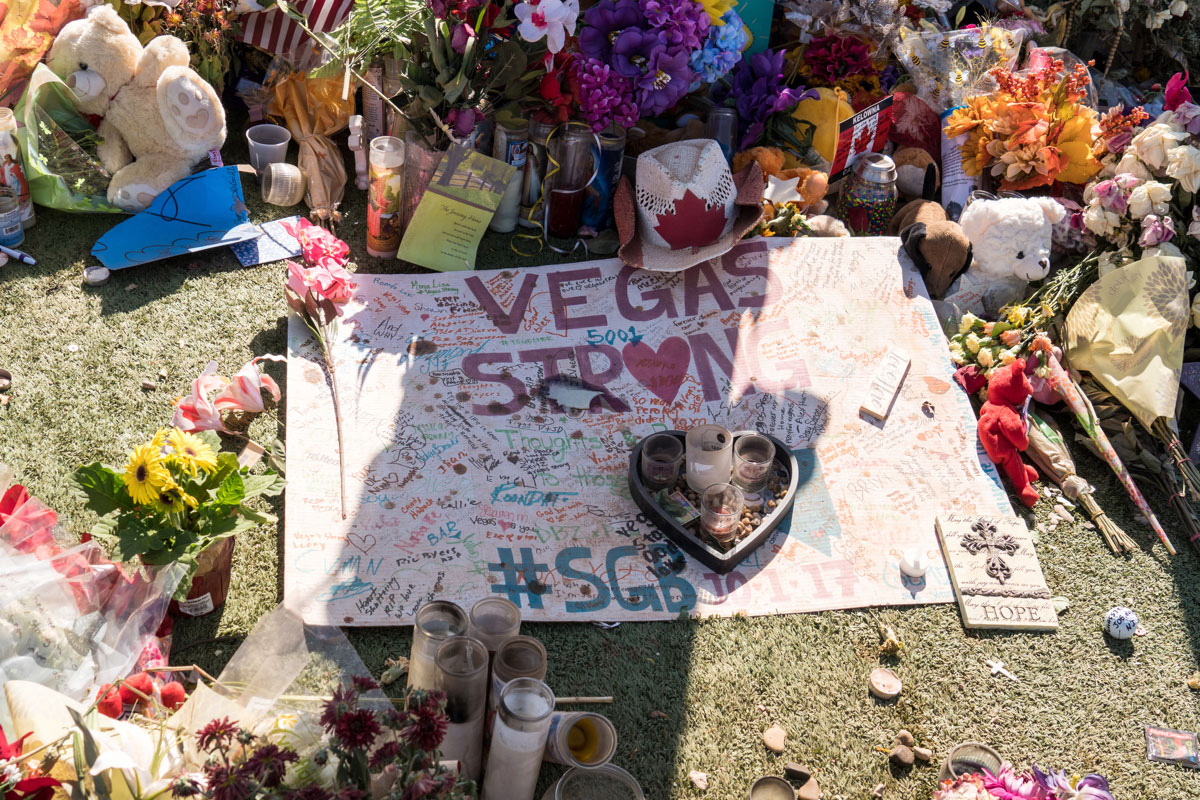  Flowers, candles, and cards at a Vegas Strong memorial