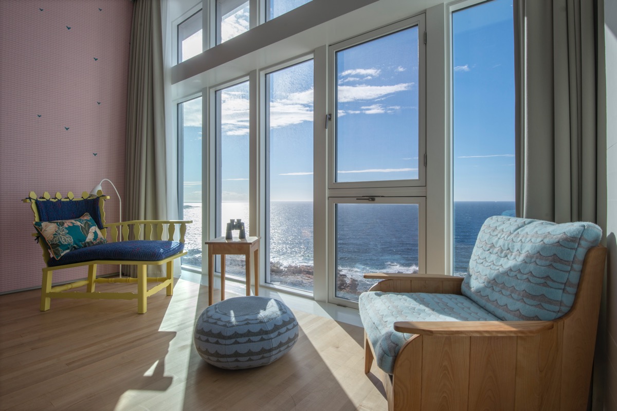 Locally handcrafted furniture and soft goods such as quilts are featured prominently in the interior design.