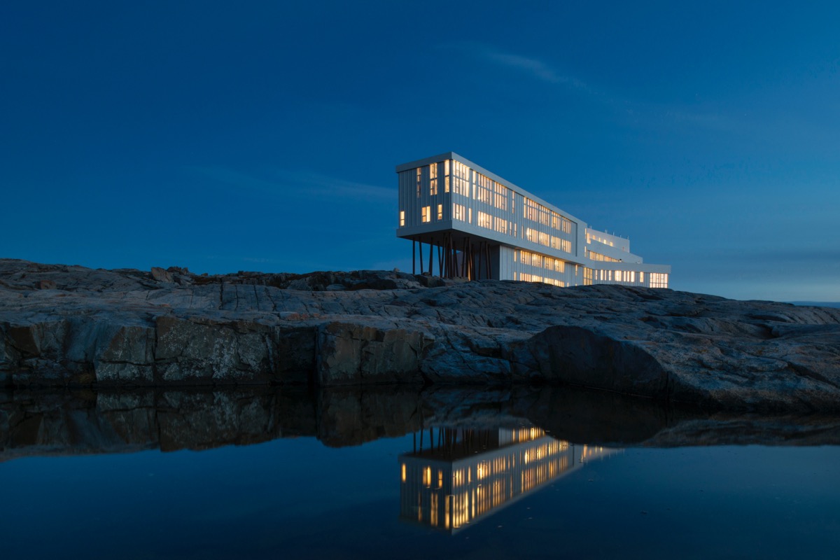 Exterior view of Fogo Island Inn at dusk.