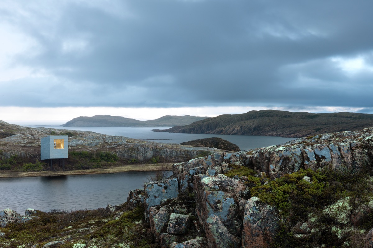 Exterior view of Fogo Island Inn with surrounding landscape.